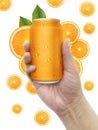 Hand holding aluminum orange soda can with fruits white background