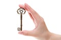 Hand holding antique key Royalty Free Stock Photo