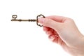 Hand holding antique key Royalty Free Stock Photo