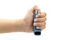 Hand holding asthma inhaler equipment.Pharmaceutical product for treat and prevent wheezing and shortness of breath and