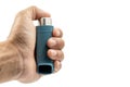 Hand holding asthma inhaler equipment.Pharmaceutical product for treat and prevent wheezing and shortness of breath and