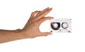 Hand holding audio casette isolated on white clipping path