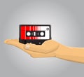 Hand holding an audio casette Royalty Free Stock Photo