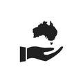 Hand holding Australia icon. Black continent outline on human arm.