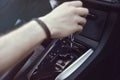 Hand Holding Automatic Transmission In Car