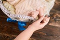 Hand holding baby foot. Royalty Free Stock Photo