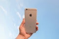 Hand holding backside of an I phone 6s Plus, Silver Royalty Free Stock Photo