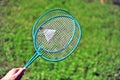 Hand holding badminton rackets Royalty Free Stock Photo