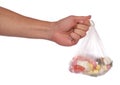 Hand holding bag of sweets