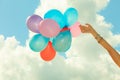Hand holding balloons sky background Royalty Free Stock Photo