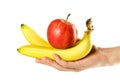 Hand holding bananas and red apple. Close up. Isolated on white background Royalty Free Stock Photo