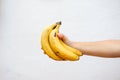 Hand holding bananas. Close up view Royalty Free Stock Photo