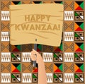 Hand holding banner with Happy Kwanzaa! text. Royalty Free Stock Photo