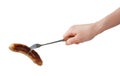 Hand holding barbecue fork BBQ sausage Royalty Free Stock Photo