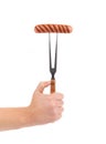 Hand holding barbecue fork. Royalty Free Stock Photo