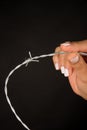 Hand holding barbed wire Royalty Free Stock Photo