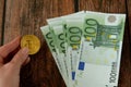 hand holding big stack of euro money on wooden background. money cash Royalty Free Stock Photo