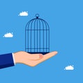 Hand holding a bird cage. Imprisonment or confinement. concept of business