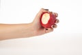 Hand holding bitten red apple isolated on white background Royalty Free Stock Photo