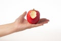 Hand holding bitten red apple isolated on white background Royalty Free Stock Photo