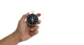 Hand Holding Black Compass on Bright White Background Navigation Concept Royalty Free Stock Photo