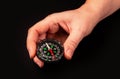 Hand holding the black compass isolated Royalty Free Stock Photo
