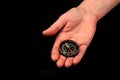 Hand holding the black compass isolated Royalty Free Stock Photo
