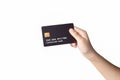 Hand holding black credit or debit card isolated on white background Royalty Free Stock Photo