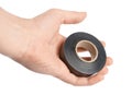 Hand holding black electrical tape Royalty Free Stock Photo