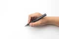 Hand holding black fountain pen writing on white paper Royalty Free Stock Photo