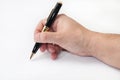 Hand holding black pen and writing Royalty Free Stock Photo