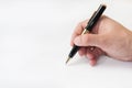 Hand holding black pen and writing Royalty Free Stock Photo