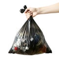 Hand holding a black plastic garbage bag isolated on white background Royalty Free Stock Photo