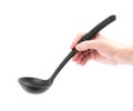 Hand holding a black plastic ladle. Close up. Isolated on a white background Royalty Free Stock Photo