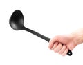 Hand holding a black plastic ladle. Close up. Isolated on a white background Royalty Free Stock Photo