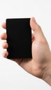 Hand holding black rectangle object isolated on white background Royalty Free Stock Photo