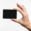 Hand holding a black rectangular object against a white background Royalty Free Stock Photo