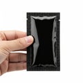 Hand holding black rectangular object isolated on white background Royalty Free Stock Photo