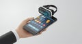 Hand Holding Black Smartphone with Augmented VR Headset Floating with White Background Digital Connectivity Royalty Free Stock Photo