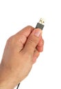 Hand holding black USB cable Royalty Free Stock Photo