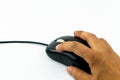 Hand holding black wired mouse isolate Royalty Free Stock Photo