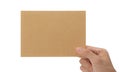 Hand holding blank cardboard paper isolated on white background with clipping path, Greeting card mockup. Royalty Free Stock Photo