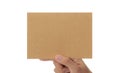 Hand holding blank cardboard paper isolated on white background with clipping path, Greeting card mockup. Royalty Free Stock Photo