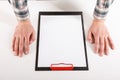 Hand holding blank clip board with white paper design mockup. Royalty Free Stock Photo