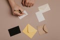 Hand holding blank envelope and letter mockup Royalty Free Stock Photo