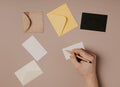 Hand holding blank envelope and letter mockup Royalty Free Stock Photo