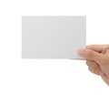 Hand holding blank paper isolated on white background with clipping path, Greeting card mockup. Royalty Free Stock Photo