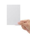 Hand holding blank paper isolated on white background with clipping path, Greeting card mockup. Royalty Free Stock Photo