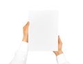 Hand holding blank paper sheet. Corporate letterhead
