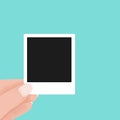 Hand holding blank retro paper photo frame. instant photo frame polaroid concept. Vector flat cartoon illustration for web sites